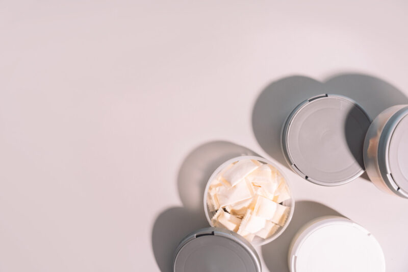 plastic jars with snus bags under hard light top v 2024 06 03 19 12 59 utc