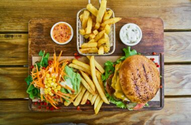 fries and burger on brown wooden tray