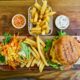 fries and burger on brown wooden tray