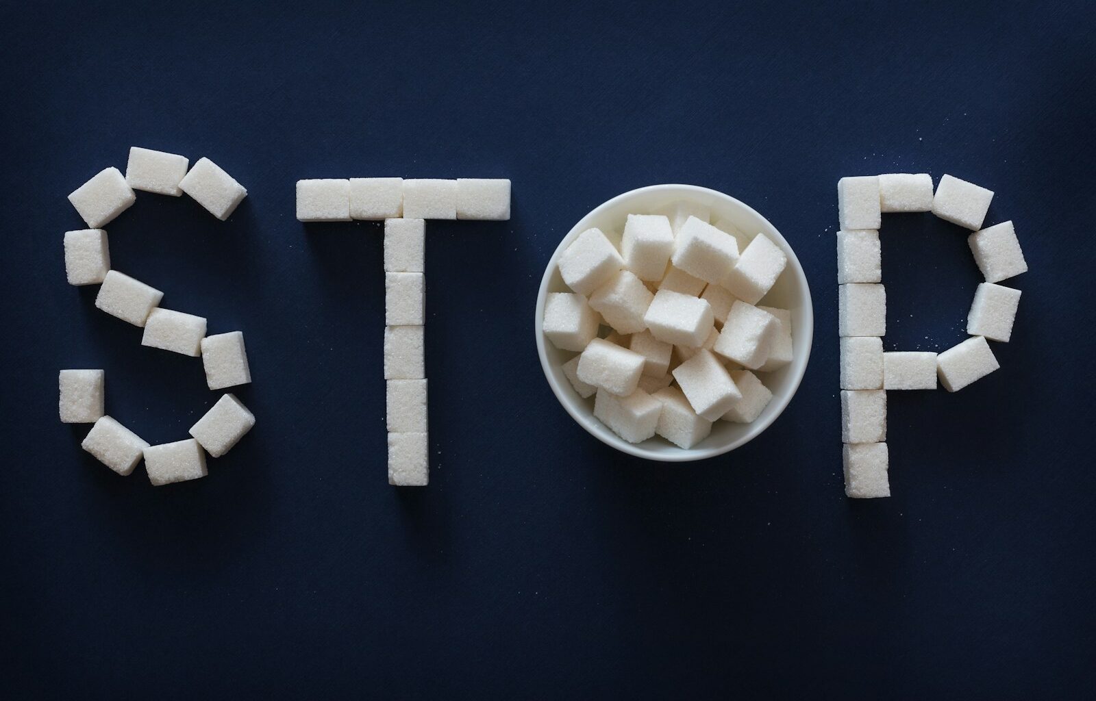 the word stop spelled out of marshmallows in a bowl