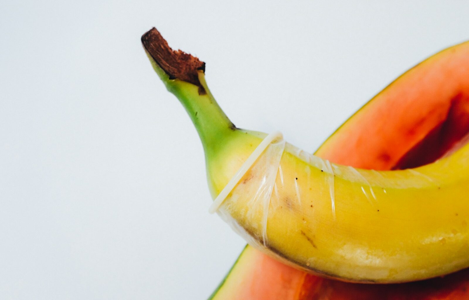 yellow banana fruit on white surface