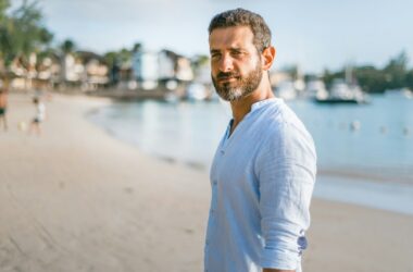 man standing on beach during daytime