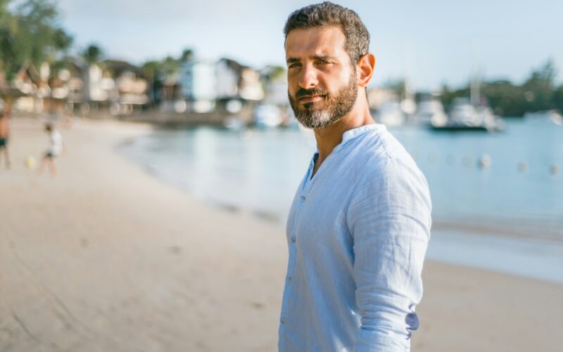 man standing on beach during daytime