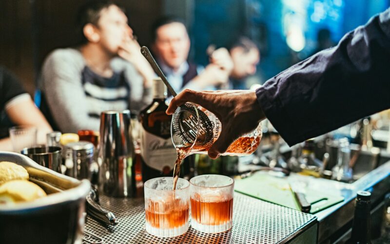man pouring drink