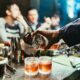 man pouring drink