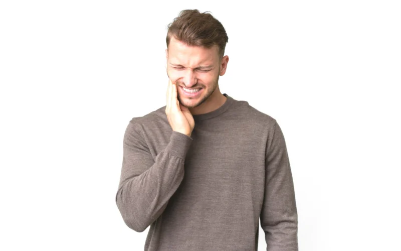 young handsome caucasian man isolated white background with toothachecopy