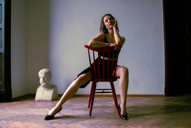 a woman sitting in a chair in a room